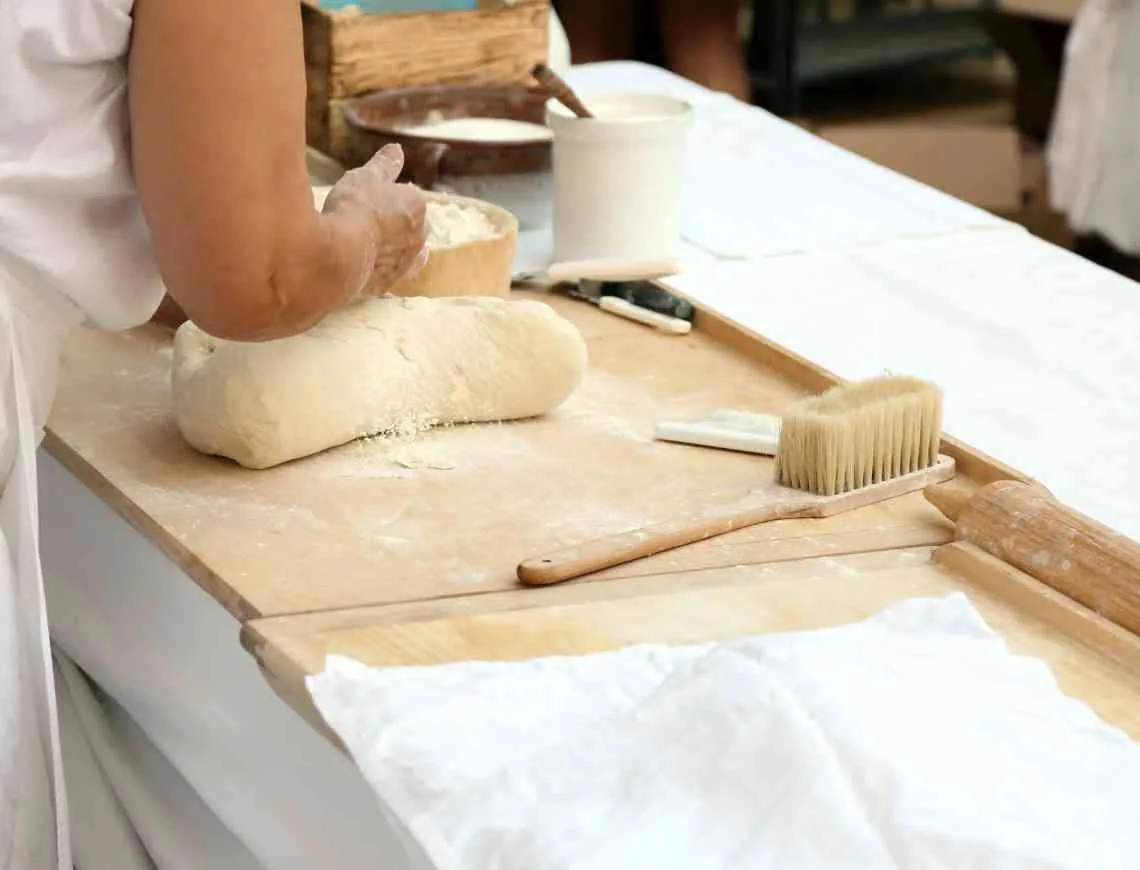 Woman making a sourdough bread loaf