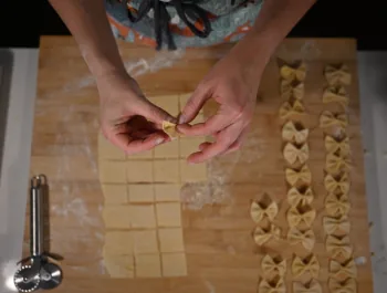 Woman making farfalle pasta - 350×265