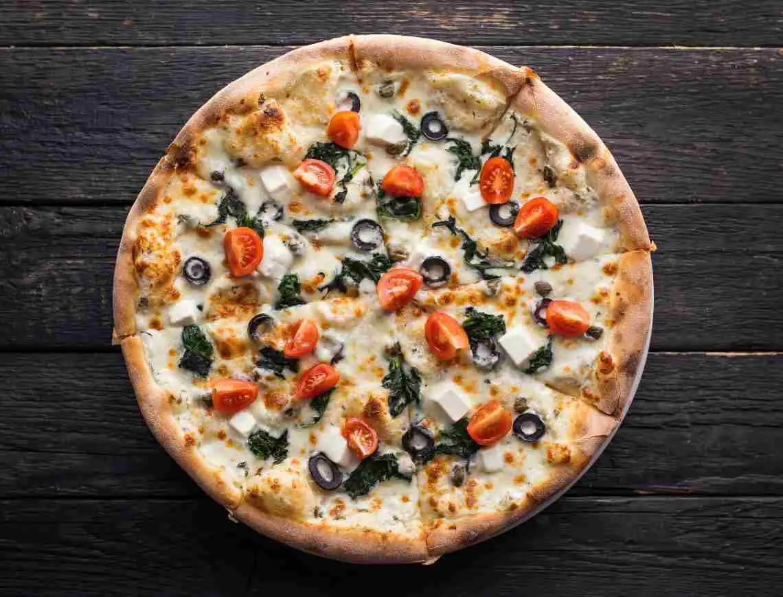 Fresh pizza with olives and cherry tomatos