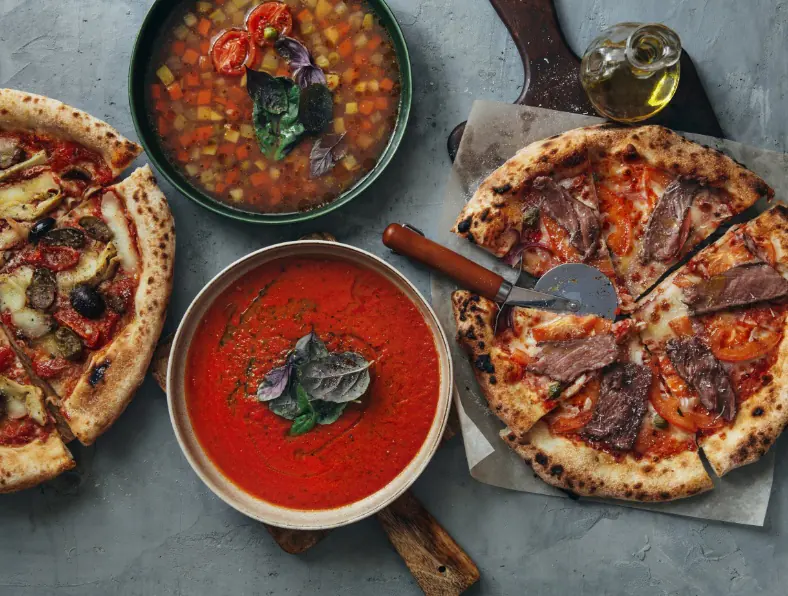 Different italian dishes on a table - 350×265