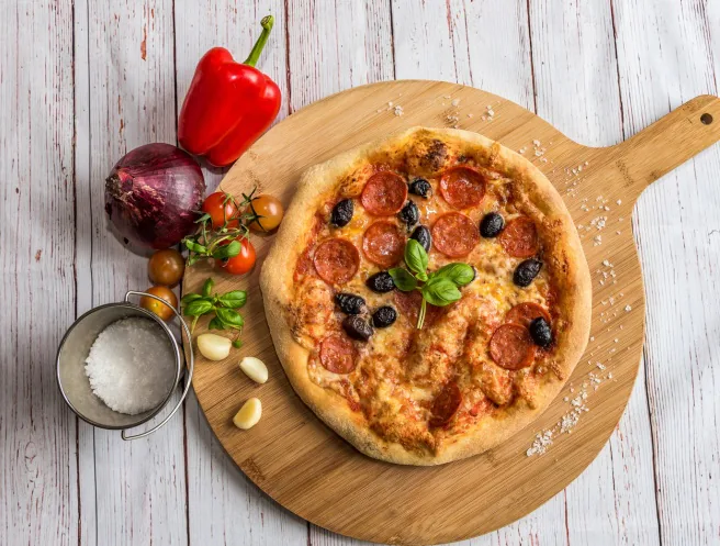 Pizza on a wooden serving board - 350×265